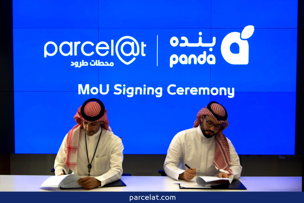 Parcelat and Panda executives signing MoU at ceremony.